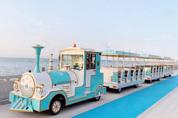 Large Scale Trackless Tourist Train with 60 Seats Running by the Coast